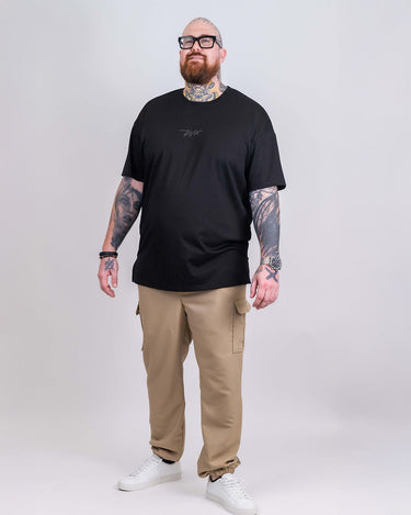 Model is 6'5", 310 lbs, wearing size 2XL
