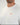 Close-up of a tall man wearing a white crewneck t-shirt with a small orange embroidered Wadlow logo on the chest.