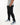 Black jogger-style pants for tall men with side pockets and white sneakers